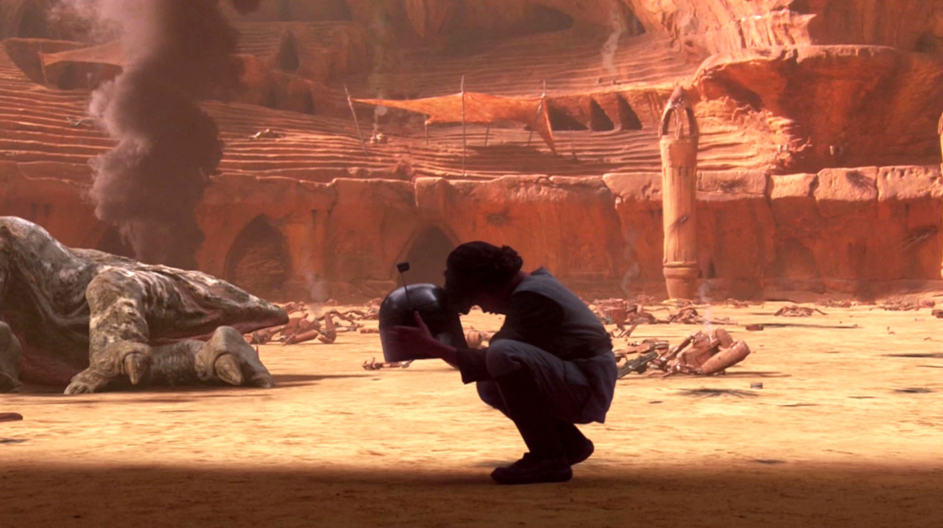 Boba Fett segura entre as mãos o capacete do seu pai Boba Fett segura entre as mãos o capacete do seu pai